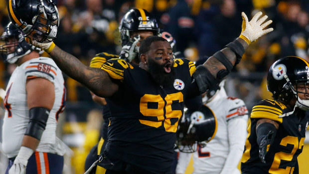 Isaiah Buggs #96 of the Pittsburgh Steelers celebrates the win against the Chicago Bears