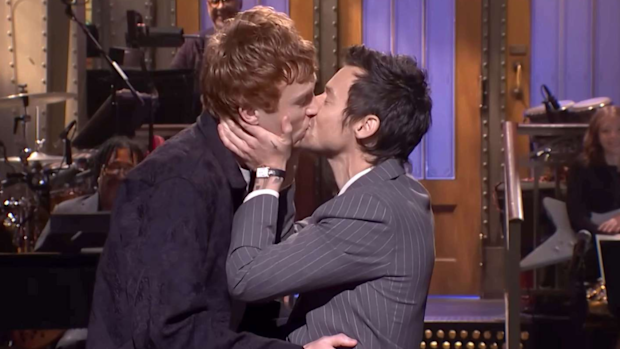 Harry Styles plants a kiss on comedian Ben Marshall during SNL monologue