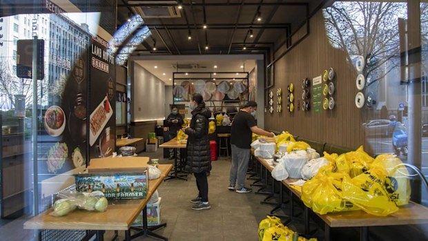 A restaurant prepares delivery meal orders during lockdown in Melbourne.