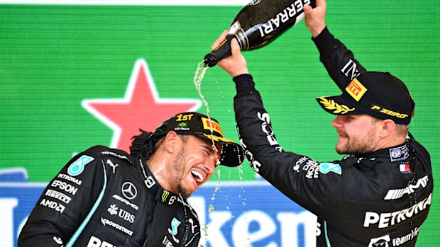 Race winner Lewis Hamilton of Great Britain and Mercedes GP and third placed Valtteri Bottas of Finland and Mercedes GP celebrate