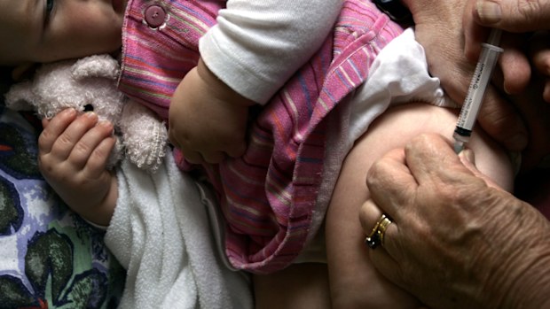 A baby in Australia receives her pneumococcal vaccine