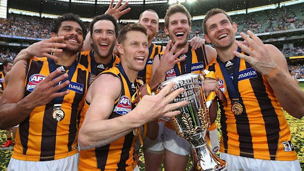 (L-R) Cyril Rioli, Jordan Lewis, Sam Mitchell, Jarryd Roughead, Grant Birchall and Luke Hodge of the Hawks celebrate winnings the 2015 AFL Grand Final 