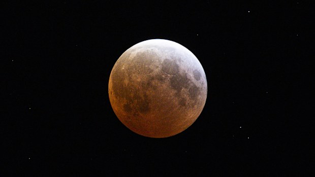 The moon is seen during a total lunar eclipse  on March 14, 2025 in Daytona Beach, Florida. 