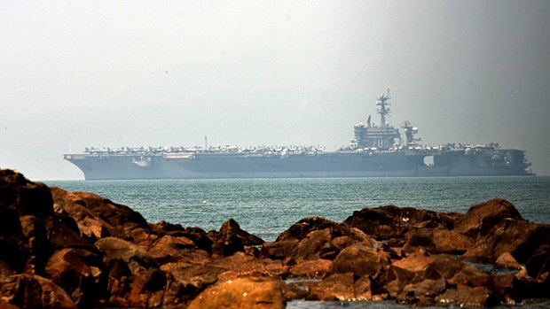 The giant US aircraft carrier enters Danang harbour in Vietnam. (AP).