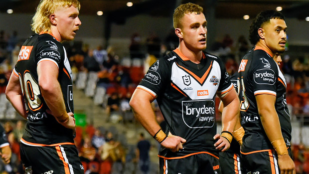 Wests Tigers players look on during their 38-0 loss to the Bulldogs.