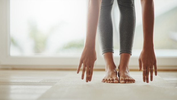 Woman stretching touching toes exercising health fitness