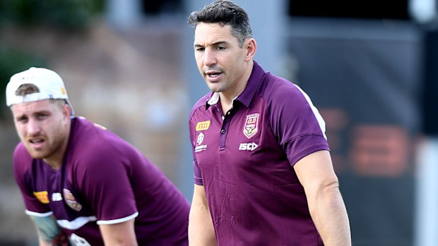 Billy Slater gives some advice to Cameron Munster during a Queensland Maroons State of Origin training session at Langlands Park on July 04, 2019