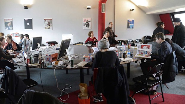 The remaining staff of Charlie Hebdo, in the Liberation offices, where they've been working since the massacre.