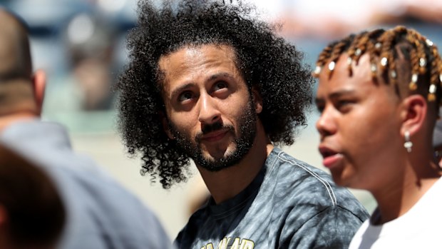 Former San Francisco 49er Colin Kaepernick watches a Women's Singles second round match between Naomi Osaka