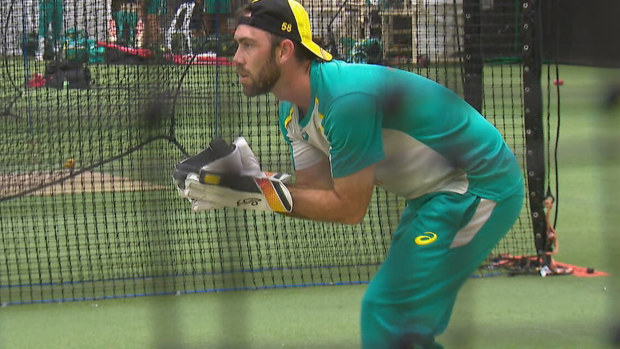 Glenn Maxwell practices with the wicketkeeping gloves prior to Australia's match against England.