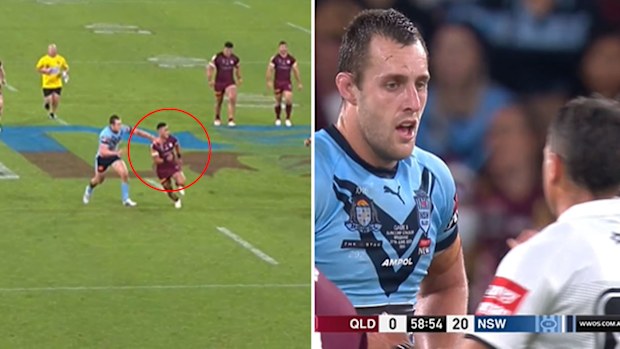 Isaah Yeo holds on to Valentine Holmes