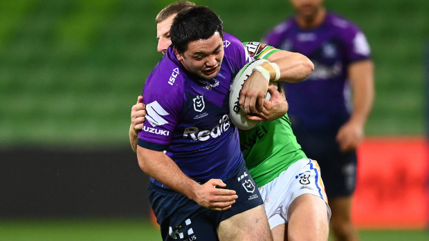  Brandon Smith of the Storm is tackled during the round three NRL match