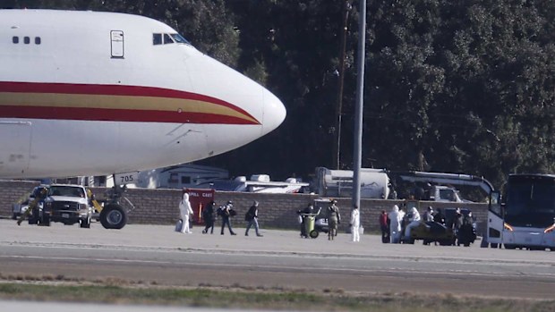 Americans disembark from a flight from Wuhan to the March Air Reserve Base in southern California.