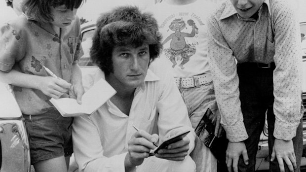 English fast bowler Bob Willis signs autographs for Sydney children in 1975