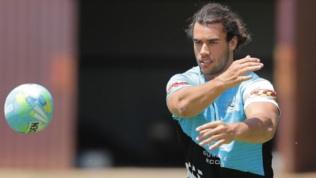  Toby Rudolf passes the ball during the Cronulla Sharks NRL training session 