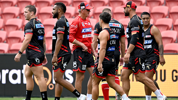 Coach Wayne Bennett with his players during a Dolphins training session.