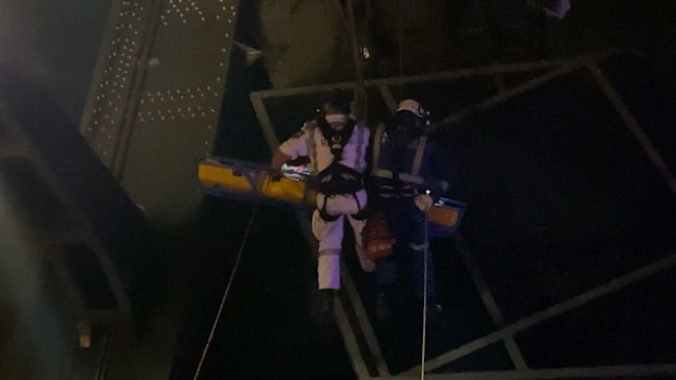 The man was safely lowered to the ground and taken to hospital.