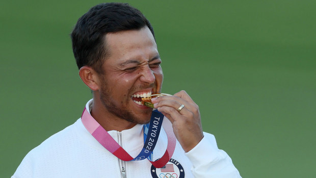 Xander Schauffele of Team United States celebrates with the gold medal during the medal ceremony after the final round of the Men's Individual Stroke Play on day nine of the Tokyo 2020 Olympic Games at Kasumigaseki Country Club on August 01, 2021 in Kawagoe, Saitama, Japan. (Photo by Mike Ehrmann/Getty Images)
