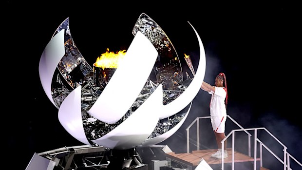 Naomi Osaka lights the cauldron at the Tokyo Olympics.