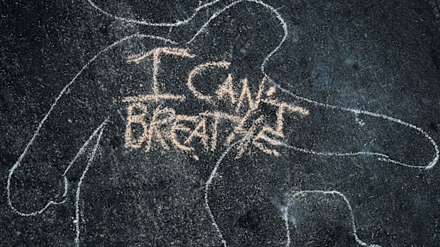 'I Can't Breathe' is scrawled on the pavement outside the District Attorney's office in Los Angeles, California during a peaceful demonstration over George Floyd's death. 