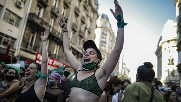 Abortion activists get revved up as they gather outside Congress while lawmakers debate a bill on the legalisation of abortion, in Buenos Aires, Argentina, Thursday, Dec. 10, 2020