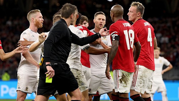 Manchester United and Leeds United players scuffle after a tackle by Ashley Young