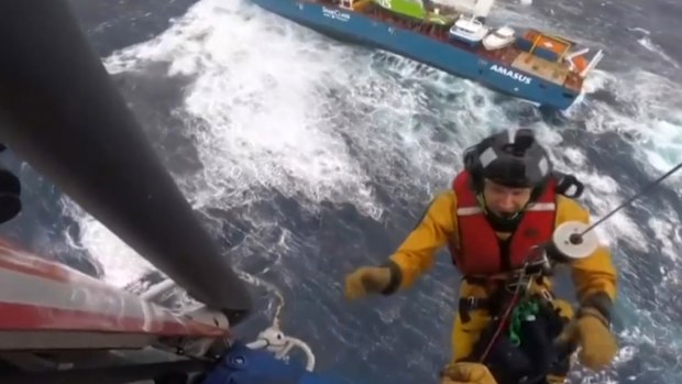 Some of the 12 crew members jumped into the ocean from the badly listing Eemslift Hendrika before being rescued by helicopter. Others were hoisted directly from the deck.