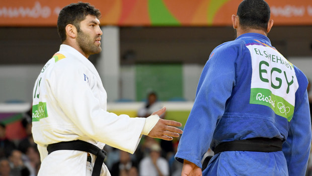 Or Sasson (left) and Islam El Shehaby (right) after their bout. (AFP)