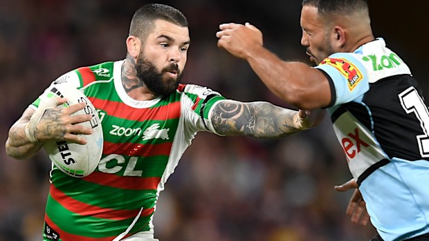 Adam Reynolds fends off the Sharks