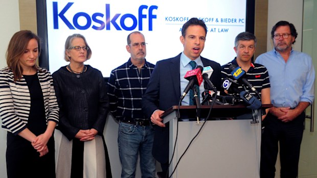 Attorney Josh Koskoff alongside families of Sandy Hook victims.
