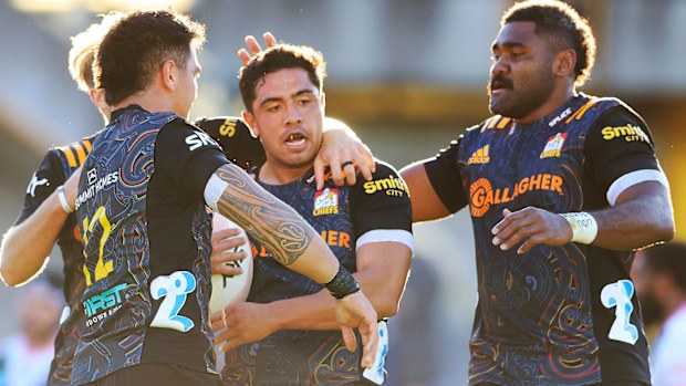 Anton Lienert-Brown of the Chiefs celebrates a try with team mates during the round four Super Rugby Trans-Tasman match between the Chiefs and the Melbourne Rebels at Leichhardt Oval on June 06, 2021 in Sydney, Australia. (Photo by Mark Evans/Getty Images)