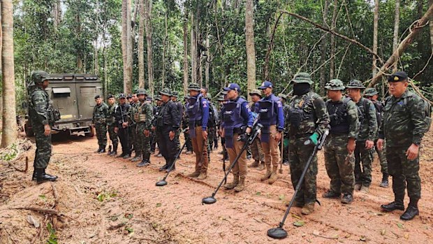 Thai soldiers inspect a border area in Ubon Ratchathani province where the Royal Thai Army said two anti-personnel landmines were found.