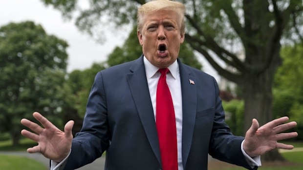 President Donald Trump talks to reporters before departing the White House for a trip to Michigan, Thursday, May 21, 2020, in Washington