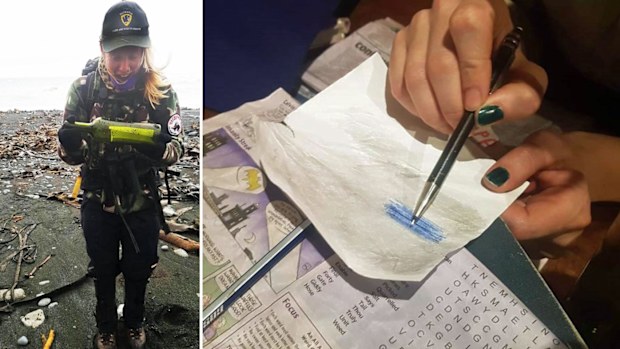 Stella Thomas with the mystery bottle. Part of the message was revealed after rubbing lead pencil over the page.