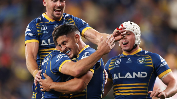 Dylan Brown of the Eels celebrates with his teammates after scoring a try