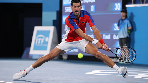 Novak Djokovic reaches for a ball in his quarter-final win over Kei Nishikori at the Tokyo Olympics.