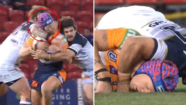 McGuire catches Ponga with 'coat hanger' style tackle. (Nine)