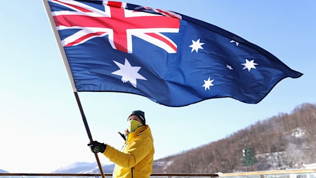 Australian Ski Cross Olympian Sami Kennedy-Sim poses with the Australian flag 