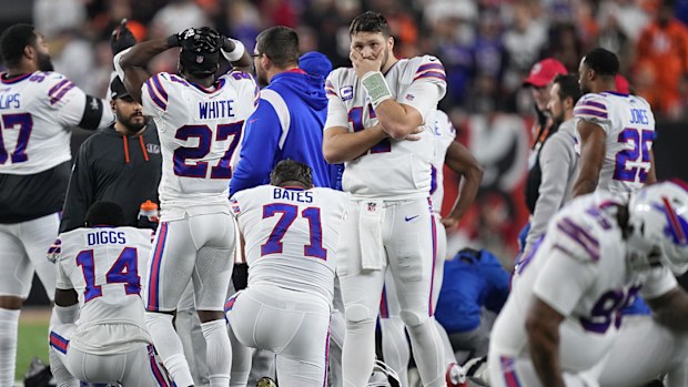 Josh Allen of the Buffalo Bills looks on after teammate Damar Hamlin collapsed following a tackle against the Cincinnati Bengals.