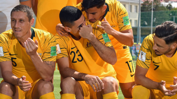 Australia's Tom Rogic and Daniel Arzani joke around before the Socceroos team photo 