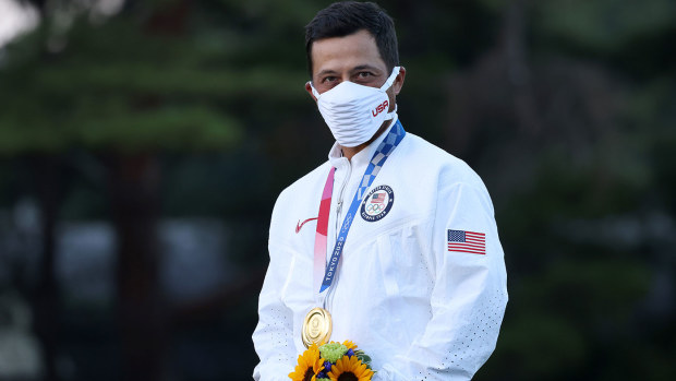 Xander Schauffele of Team United States stands on the podium while wearing the gold medal during the medal ceremony after the final round of the Men's Individual Stroke Play on day nine of the Tokyo 2020 Olympic Games at Kasumigaseki Country Club on August 01, 2021 in Kawagoe, Saitama, Japan. (Photo by Chris Trotman/Getty Images)