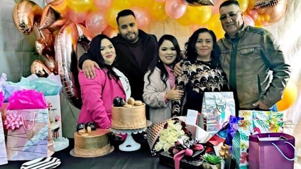 Sergio with his twin sisters and parents at the sisters' 30th birthday.