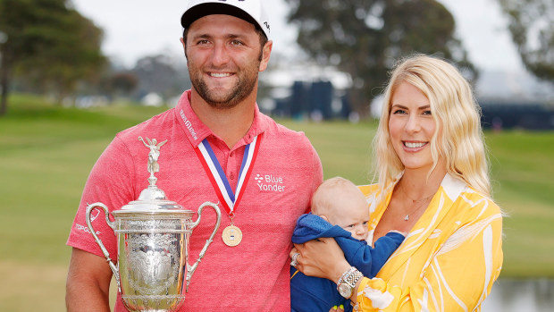 Jon Rahm of Spain celebrates with the trophy alongside his wife, Kelley, and son, Kepa, after winning the 2021 U.S. Open at Torrey Pines.