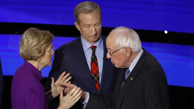 Tom Steyer finds himself awkwardly in the middle of Elizabeth Warren and Bernie Sanders post-debate.