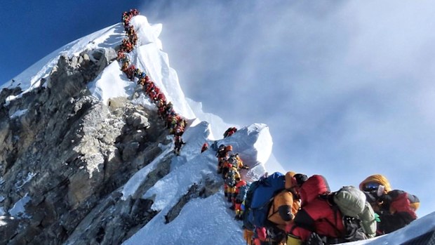 A long queue of mountain climbers line a path on Mount Everest, in this photograph that made headlines around the world.