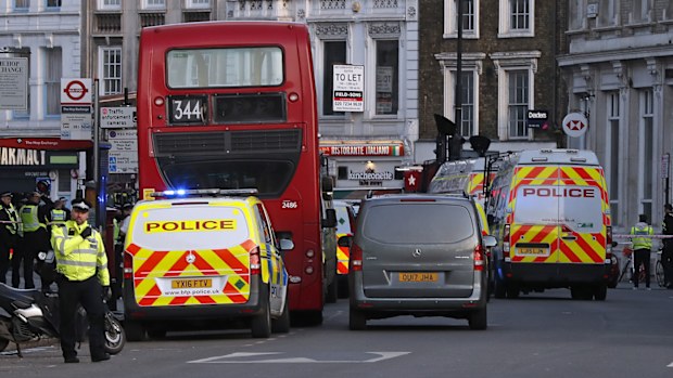 Police vehicles block the road in the Borough area at the south side of London Bridge in London, Friday, Nov. 29, 2019