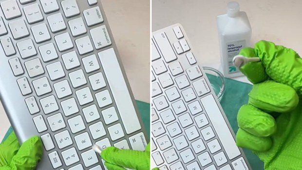 Janitor Brandon Pleshek cleans a dirty computer keyboard.