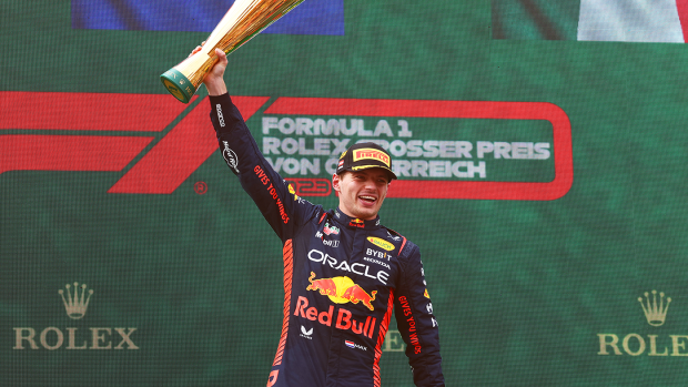 Race winner Max Verstappen celebrates on the podium of the Austrian Grand Prix.