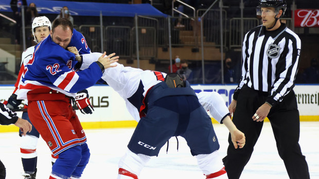 Anthony Bitetto of the New York Rangers and Michael Raffl of the Washington Capitals fight during the first period at Madison Square Garden on May 05, 2021 in New York City.