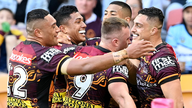 Broncos celebrate a try
